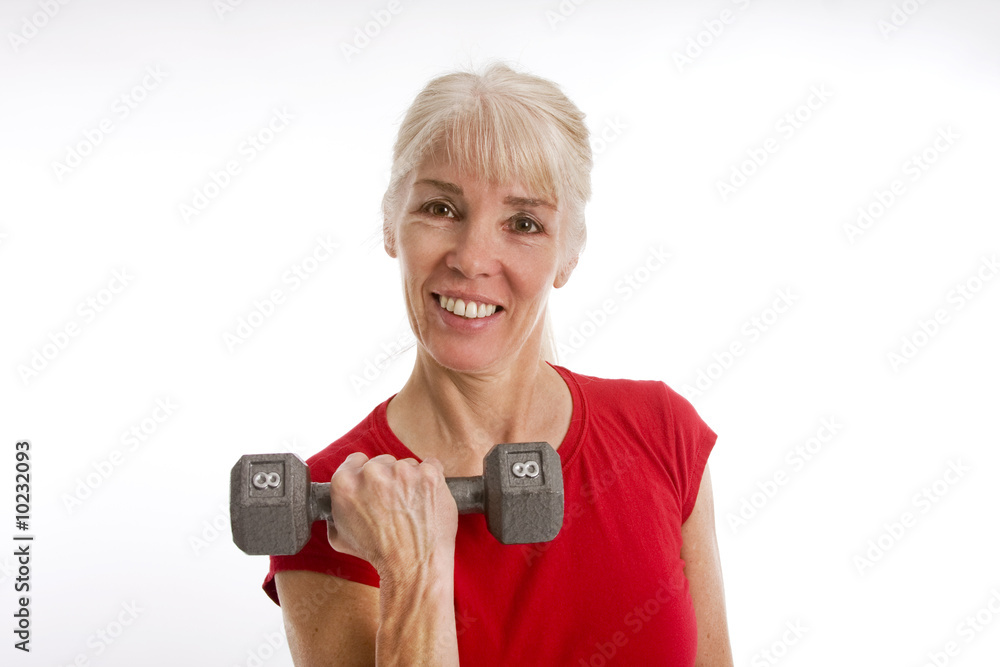 Middle-aged woman working with barbell Middle-aged woman working with barbell