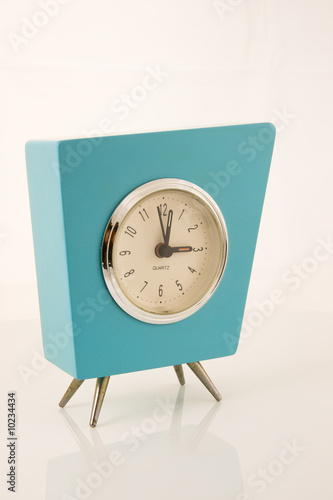 Close up of aqua retro clock isolated on white background