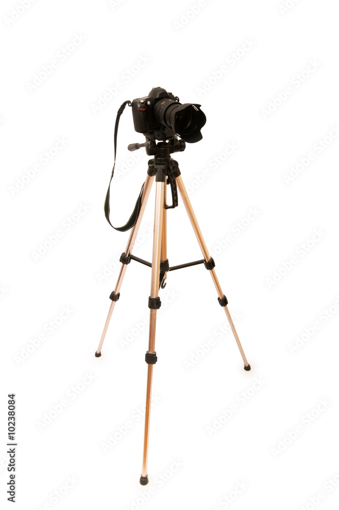 Tripod and camera isolated on the white background. Tripod and camera isolated on the white background.
