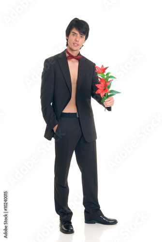 Handsome male gigolo with flower, Studio shot,