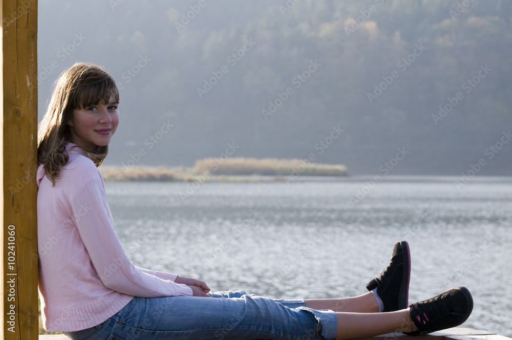 Teenage girl  portrait over lake