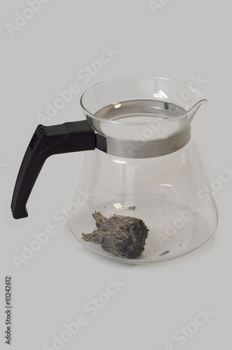 A glass teapot with Lotus F...