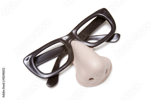 Funny disguise glasses and nose on a white background