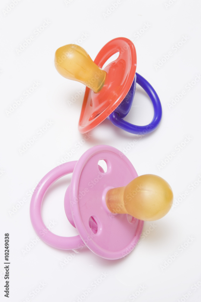 Babies dummy or pasifier isolated on a white studio background Babies dummy or pasifier isolated on a white studio background