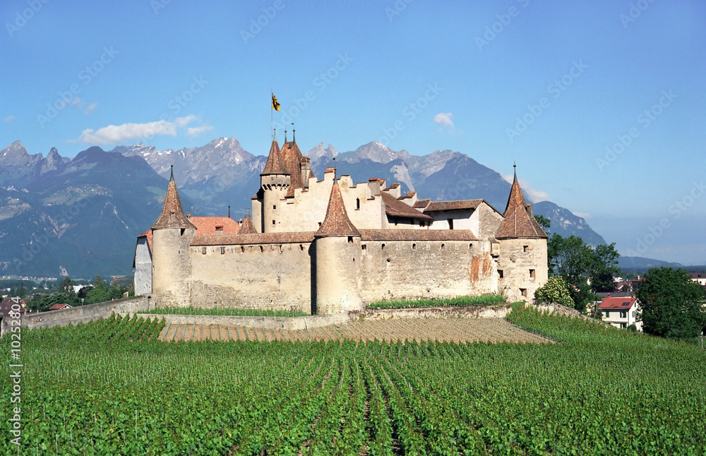 Old swiss castle under Alps mountains