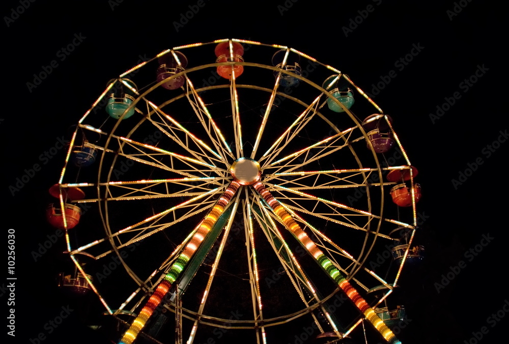 Ferris wheel. Night entertainment. Ferris wheel. Night entertainment.