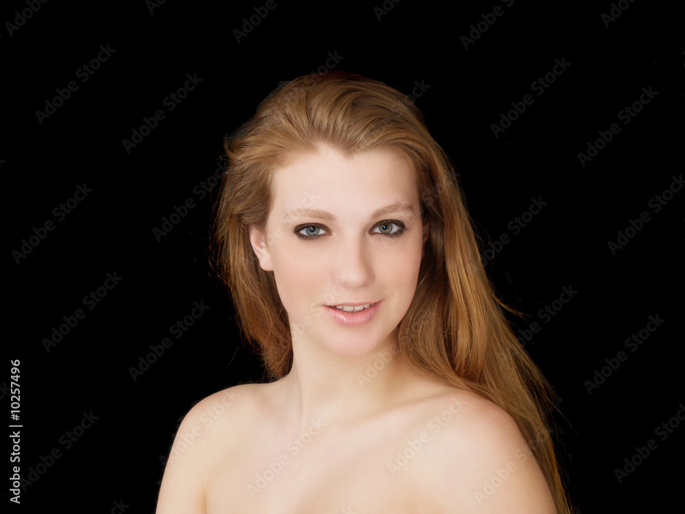 Young woman with bare shoulders and red hair Young woman with bare shoulders and red hair