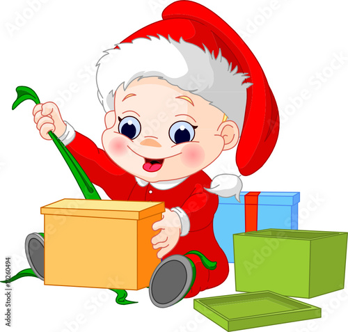 little boy in christmas hat open gift