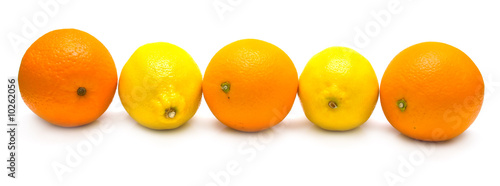 The ripe whole oranges and yellow lemon on white. Isolation