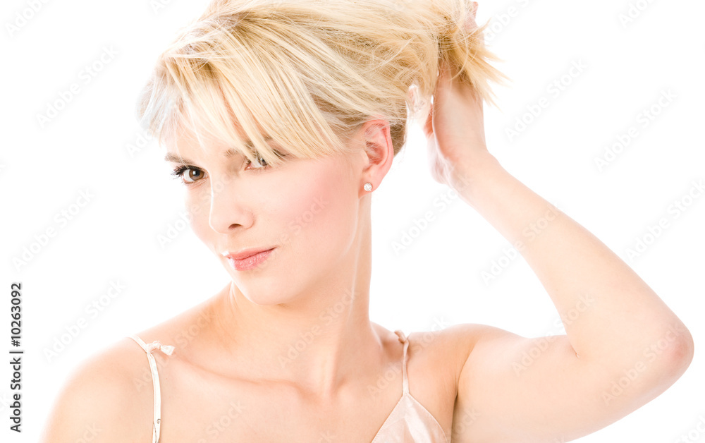 Young blonde hold hair in her hand