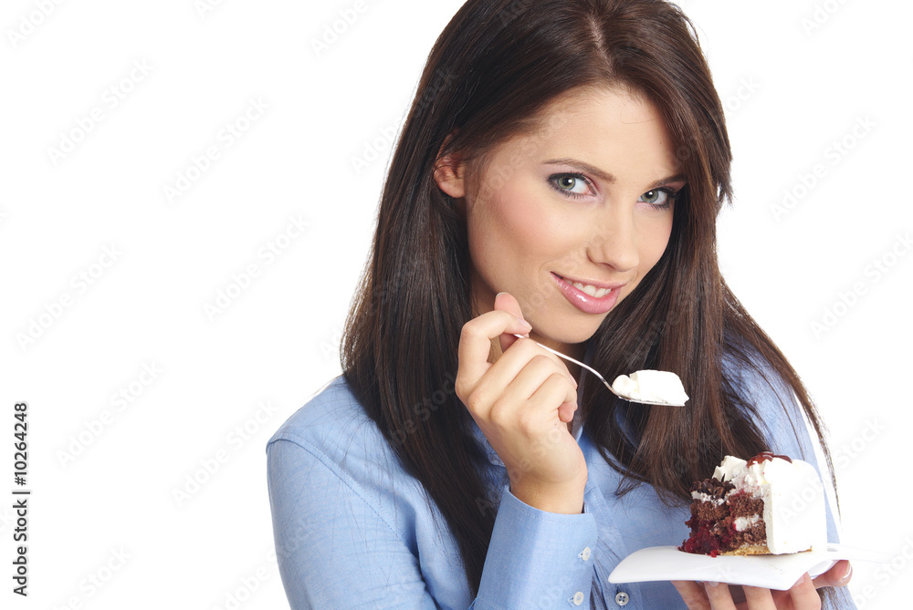 woman wearing blue shirt eating the cake. woman wearing blue shirt eating the cake.