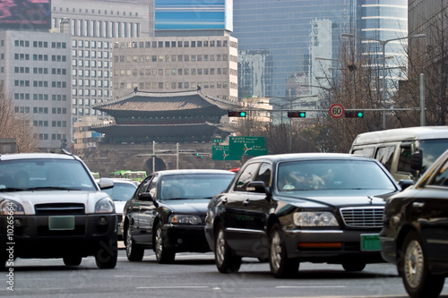 Shiny, Modern cars meet ancient history in downtown Seoul