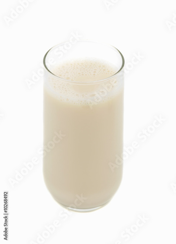 big glass of natural soy beverage, white background