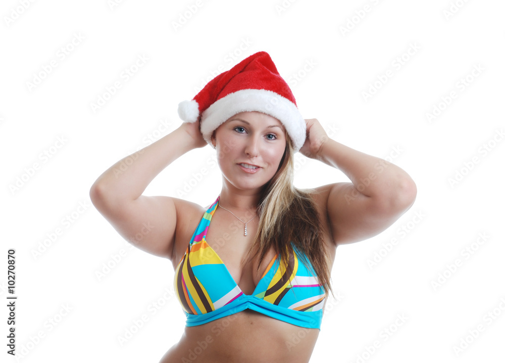 Blonde woman playing with a santa hat Blonde woman playing with a santa hat