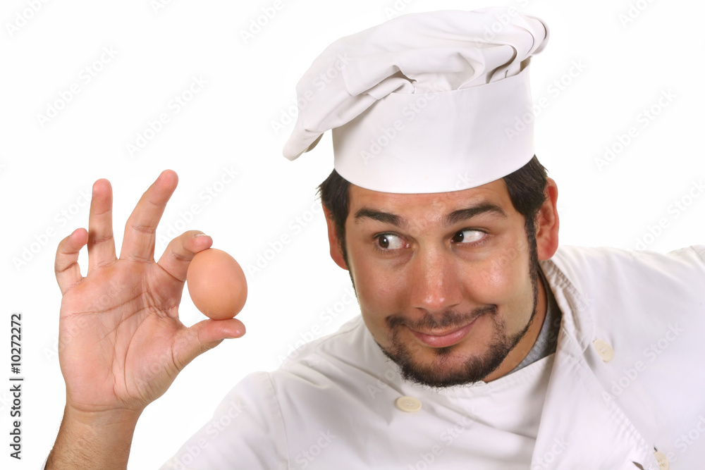 young funny chef with egg, isolated on white young funny chef with egg, isolated on white