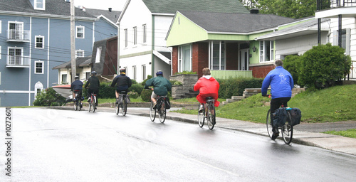 Seniors touring by bike on a rainy day photo