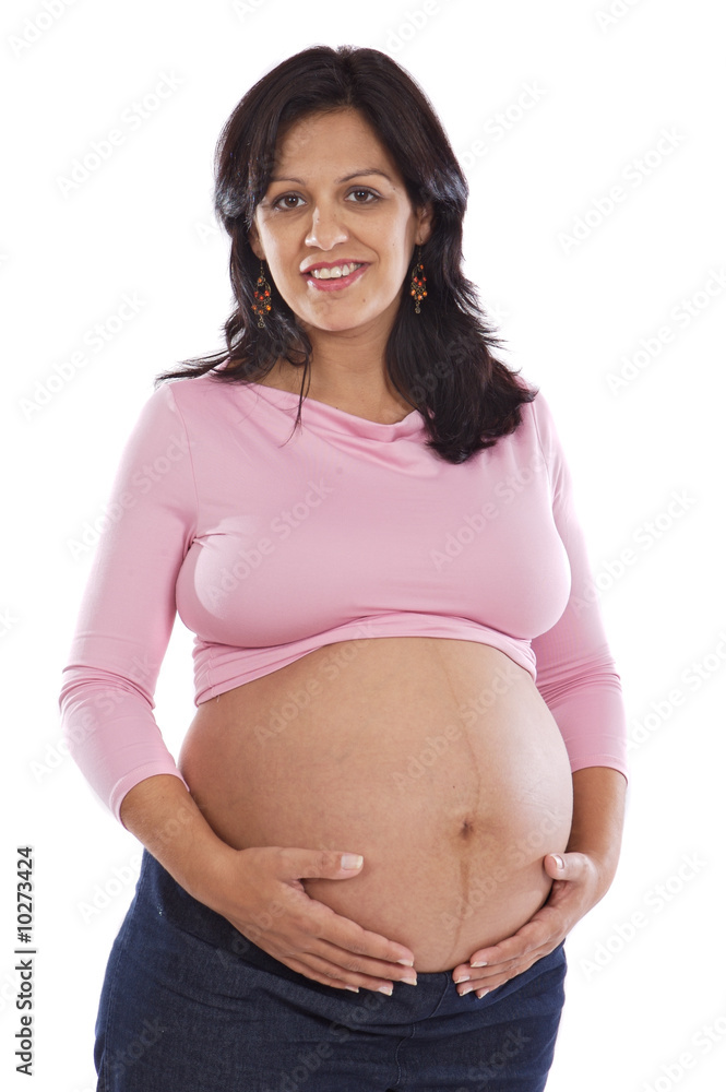 Pregnant girl feeling kicked on a white background Pregnant girl feeling kicked on a white background