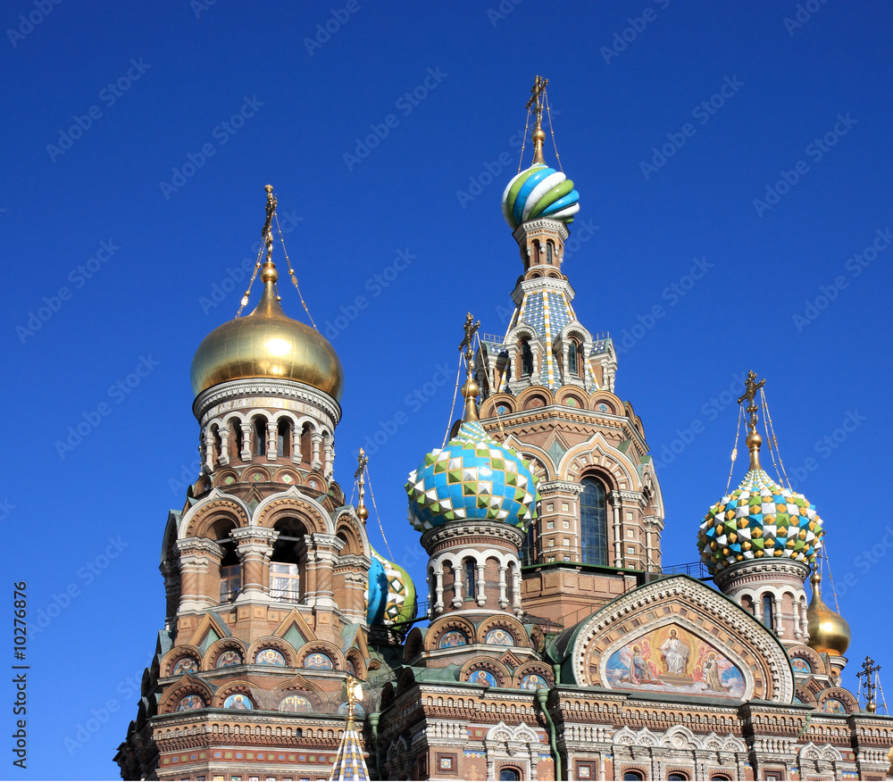 Domes of orthodox church on a blue sky background.