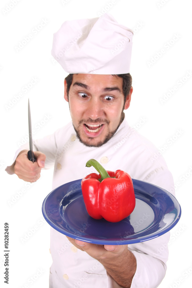 young chef holding plate with fresh pepper young chef holding plate with fresh pepper