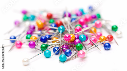 color pins isolated on white. (selective focus)