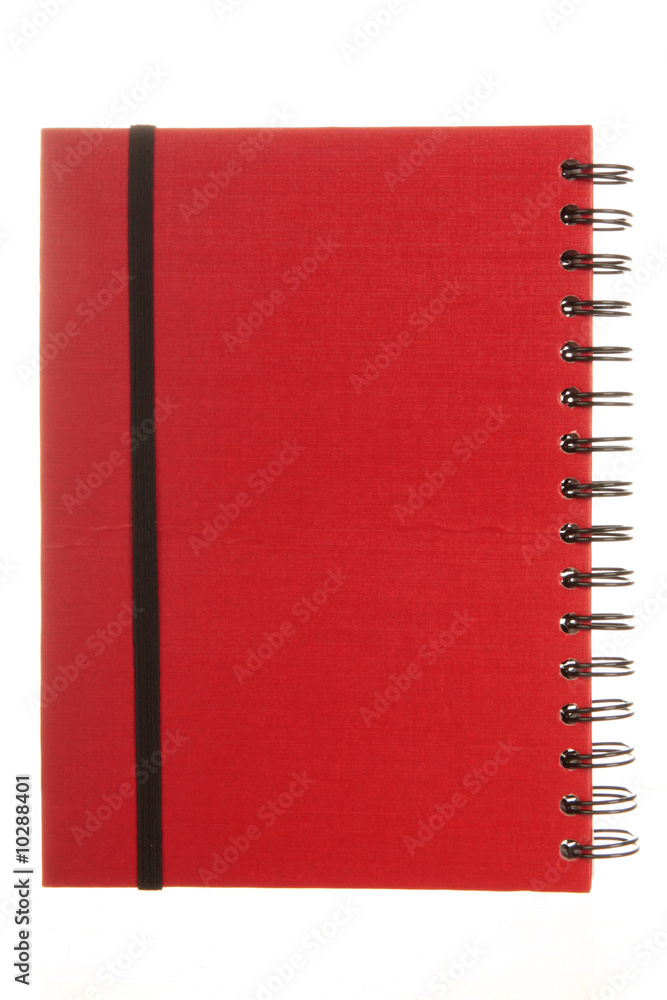 A red spiral notebook, isolated on white A red spiral notebook, isolated on white