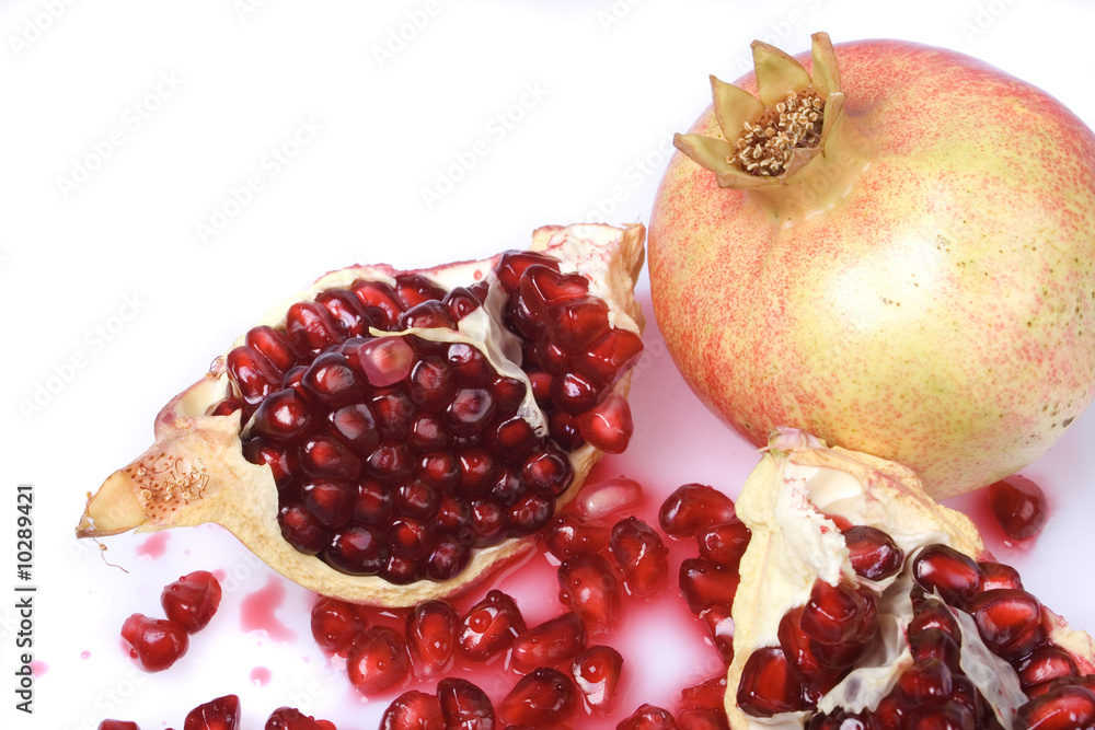 Ripe pomegranate fruit isolated on white background Ripe pomegranate fruit isolated on white background