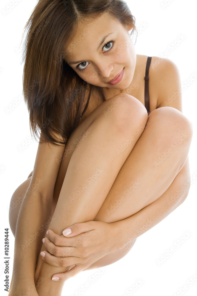 Fototapeta premium Beautiful young woman on the white background