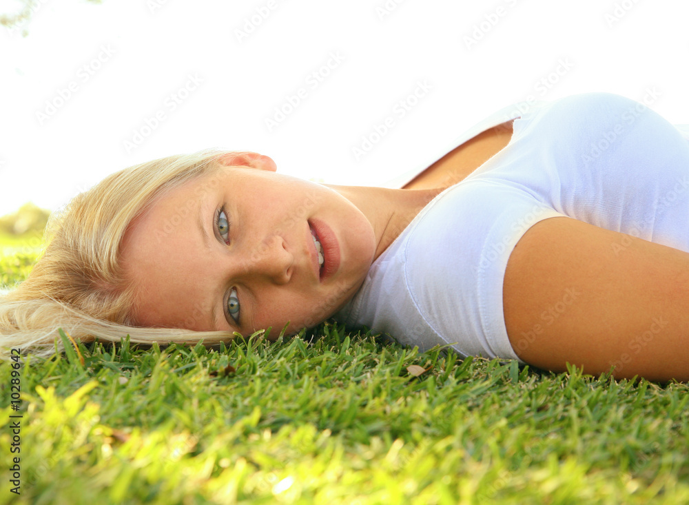 beautiful caucasian female model lay on grass outdoor beautiful caucasian female model lay on grass outdoor