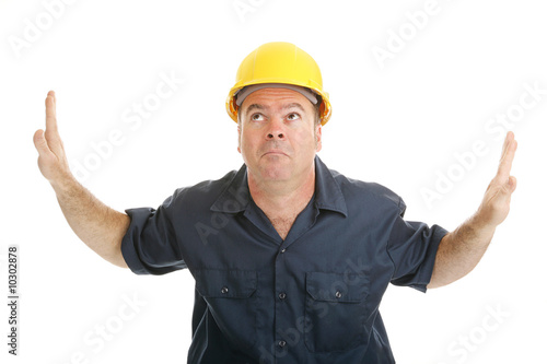 Billede på lærred Construction worker trapped between two objects or ideas