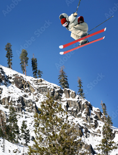 A young man jumping high at Lake Tahoe resort