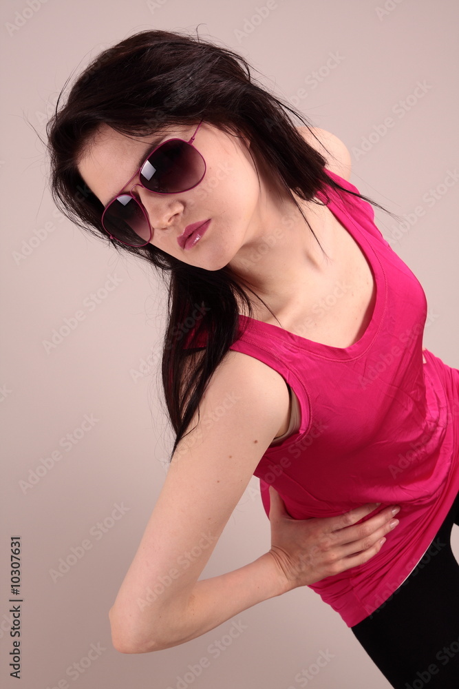 Woung woman in studio with sunglasses Woung woman in studio with sunglasses