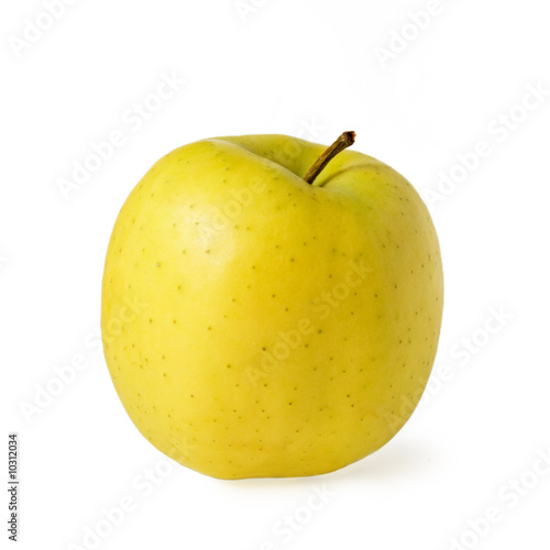 Ripe yellow apple isolated over white