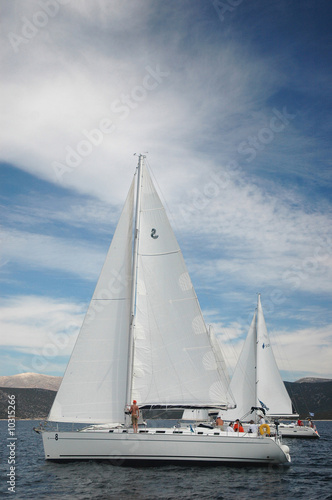 two white yacht sail in the greece © Marina Vilesova