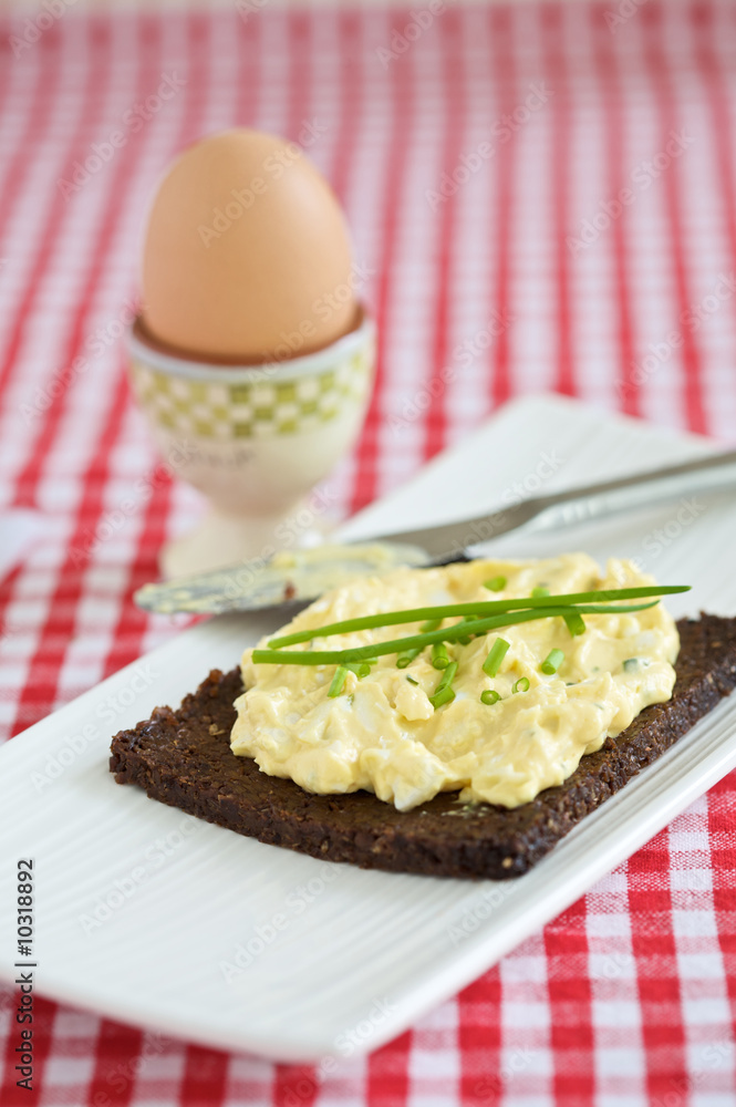 Delicious and healthy breakfast with an egg and egg-salad