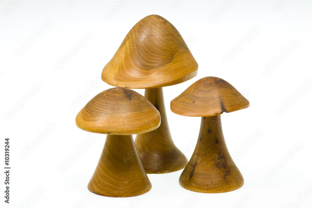 Three wooden mushrooms