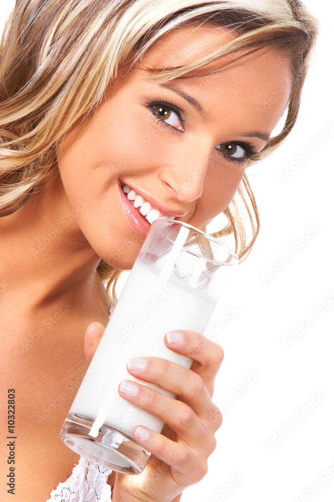 Young happy woman drinking milk. Over white background . Young happy woman drinking milk. Over white background .