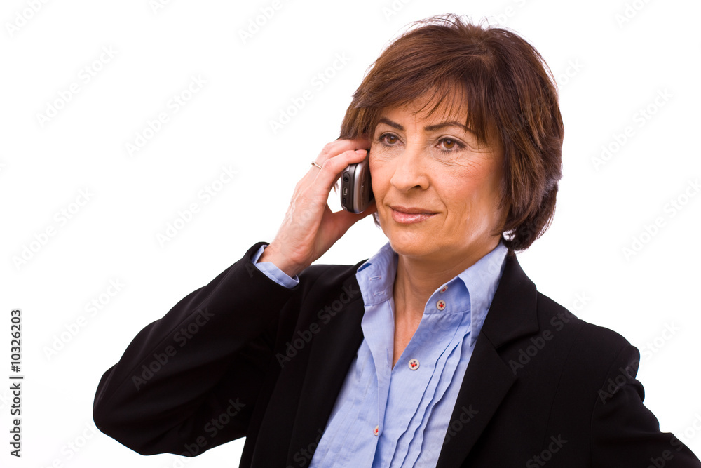 Senior businesswoman calling on mobile phone Senior businesswoman calling on mobile phone