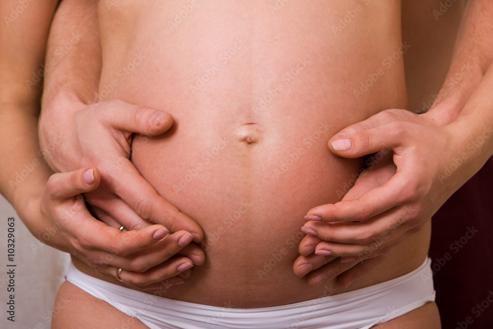 Pregnant women and her husband. Waiting for the baby Pregnant women and her husband. Waiting for the baby