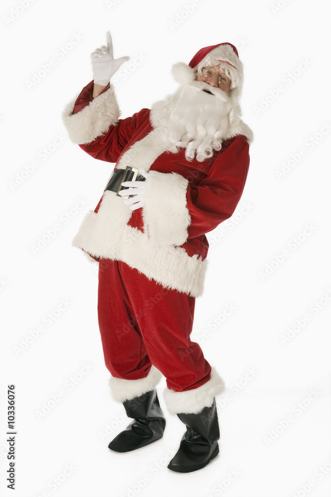 Santa Claus isolated on white background pointing upward Santa Claus isolated on white background pointing upward