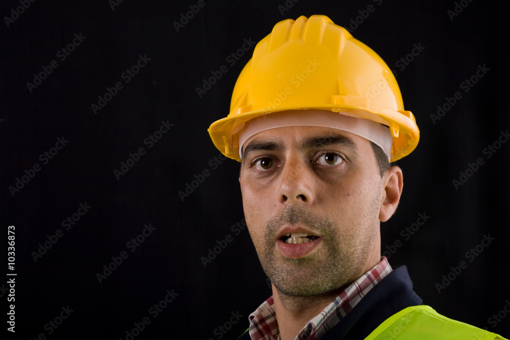 young worker portrait in a black background young worker portrait in a black background
