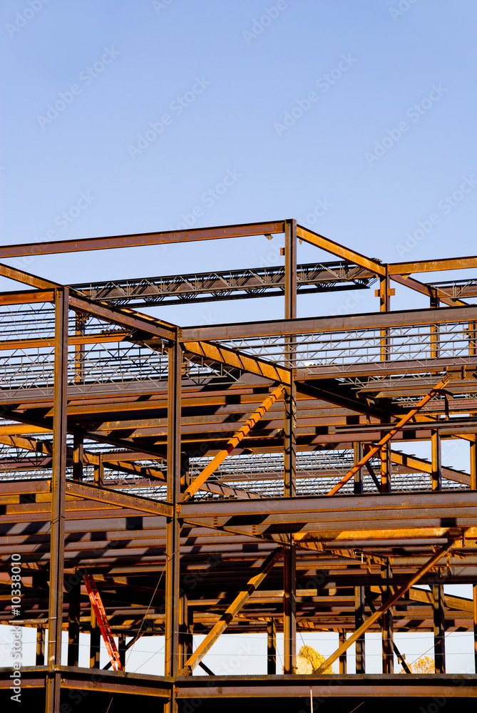 The steel frame of a building under construction. The steel frame of a building under construction.