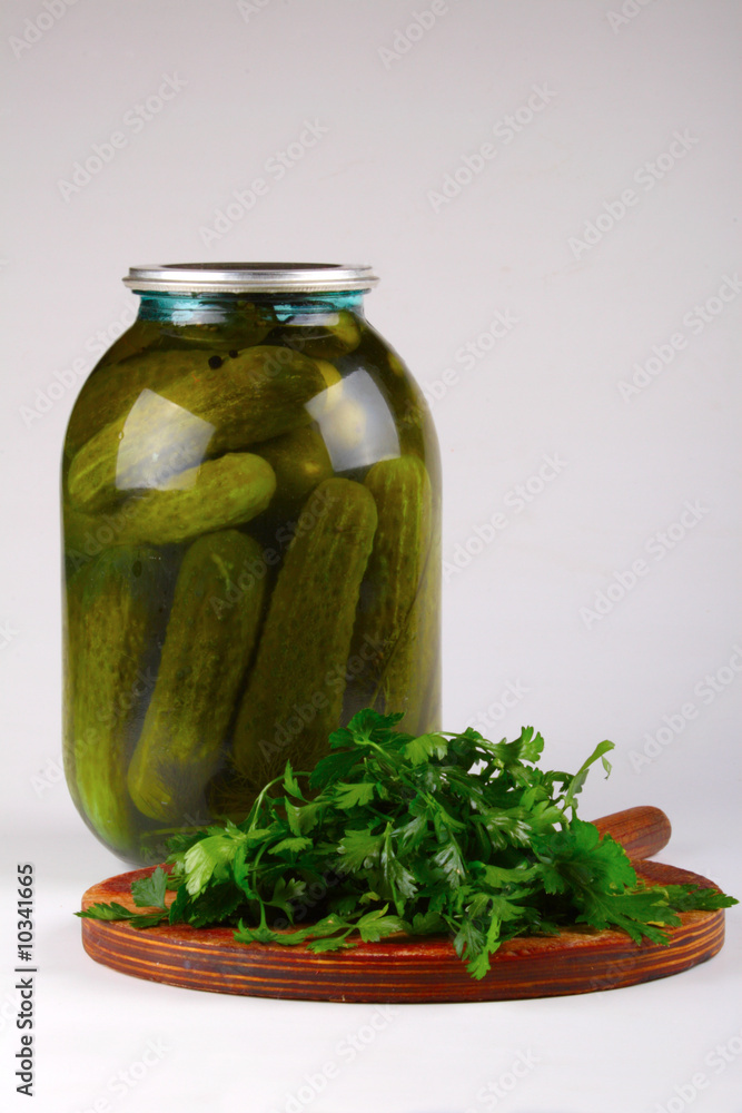 Fresh parsley and pickles in a container Fresh parsley and pickles in a container