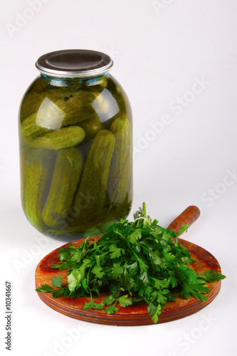 Fresh parsley and pickles in a container