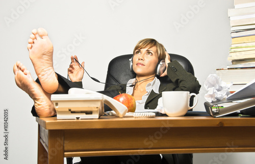 Fotografi Lazy Businesswoman or Student at a busy office desk.