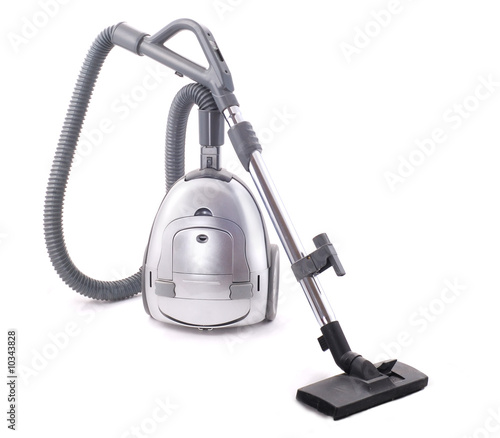 Vacuum cleaner on the white background. Old and dusty. photo