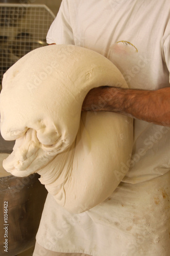 baker who works the paste in a french bakery