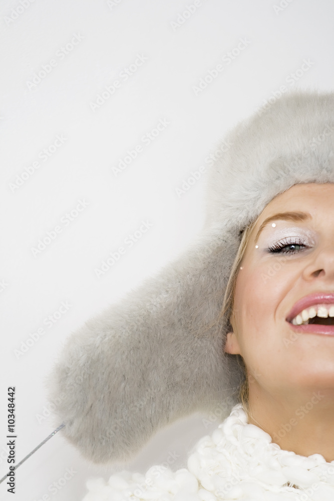 Closeup portrait of a of a smiling girl in fur hat Closeup portrait of a of a smiling girl in fur hat