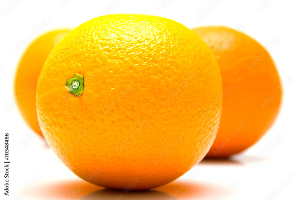 The ripe whole oranges on white, shallow DOF. Isolation The ripe whole oranges on white, shallow DOF. Isolation