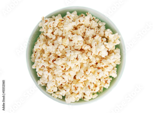 fresh popcorn on green bowl, white background