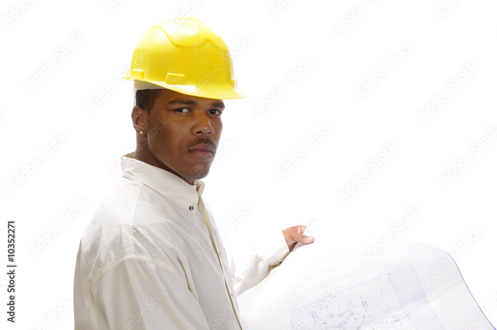 young African American engineer studying house plans young African American engineer studying house plans